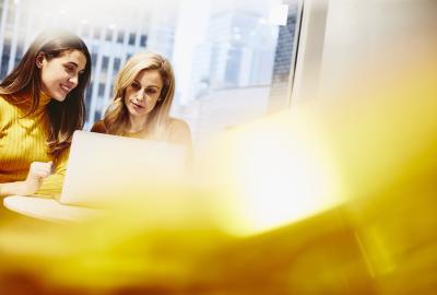 Two women working together