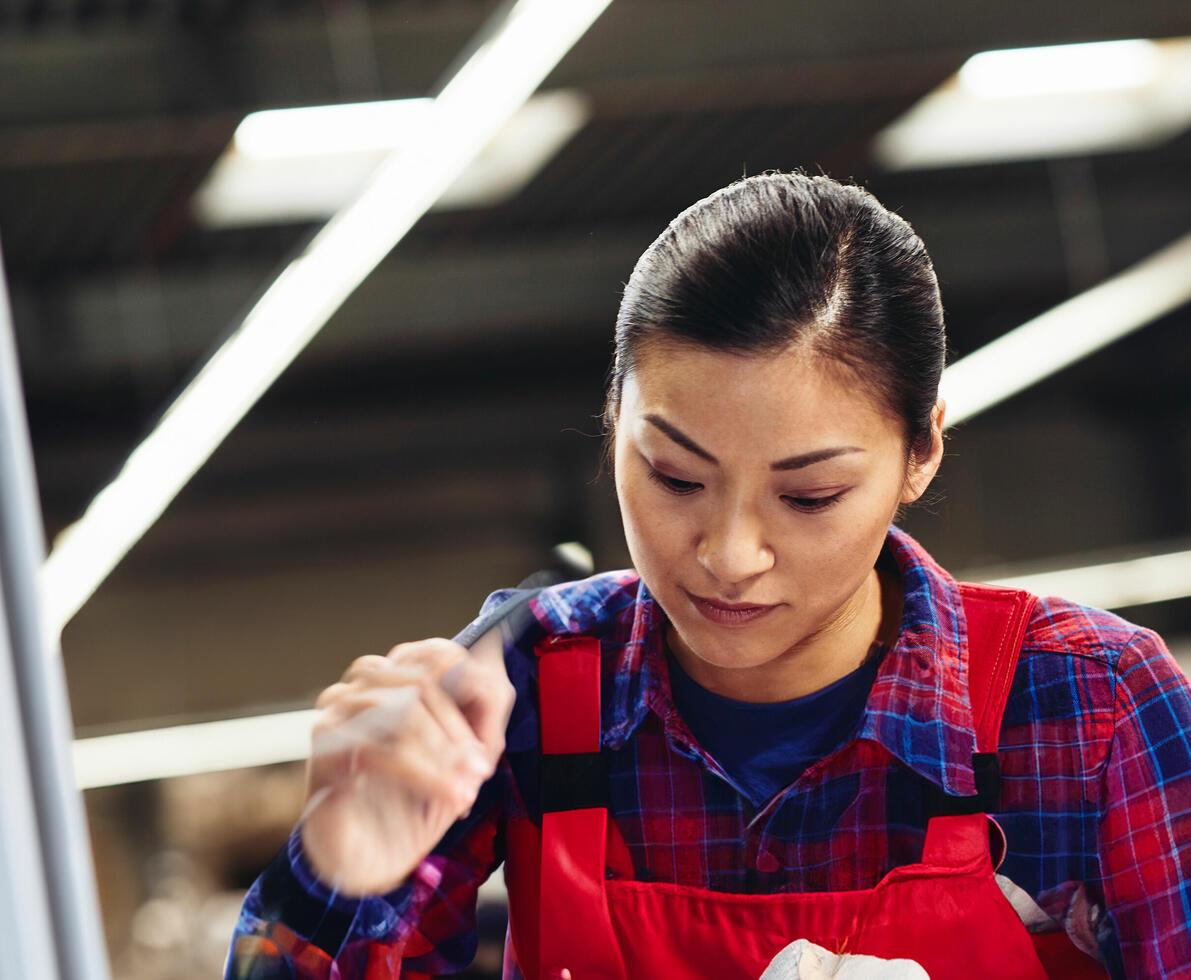 A woman in overalls