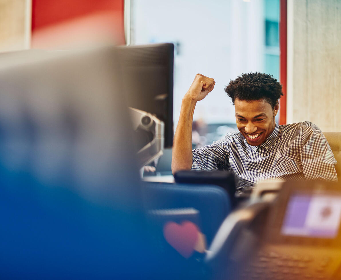 a man is very excited with his arm up in the air