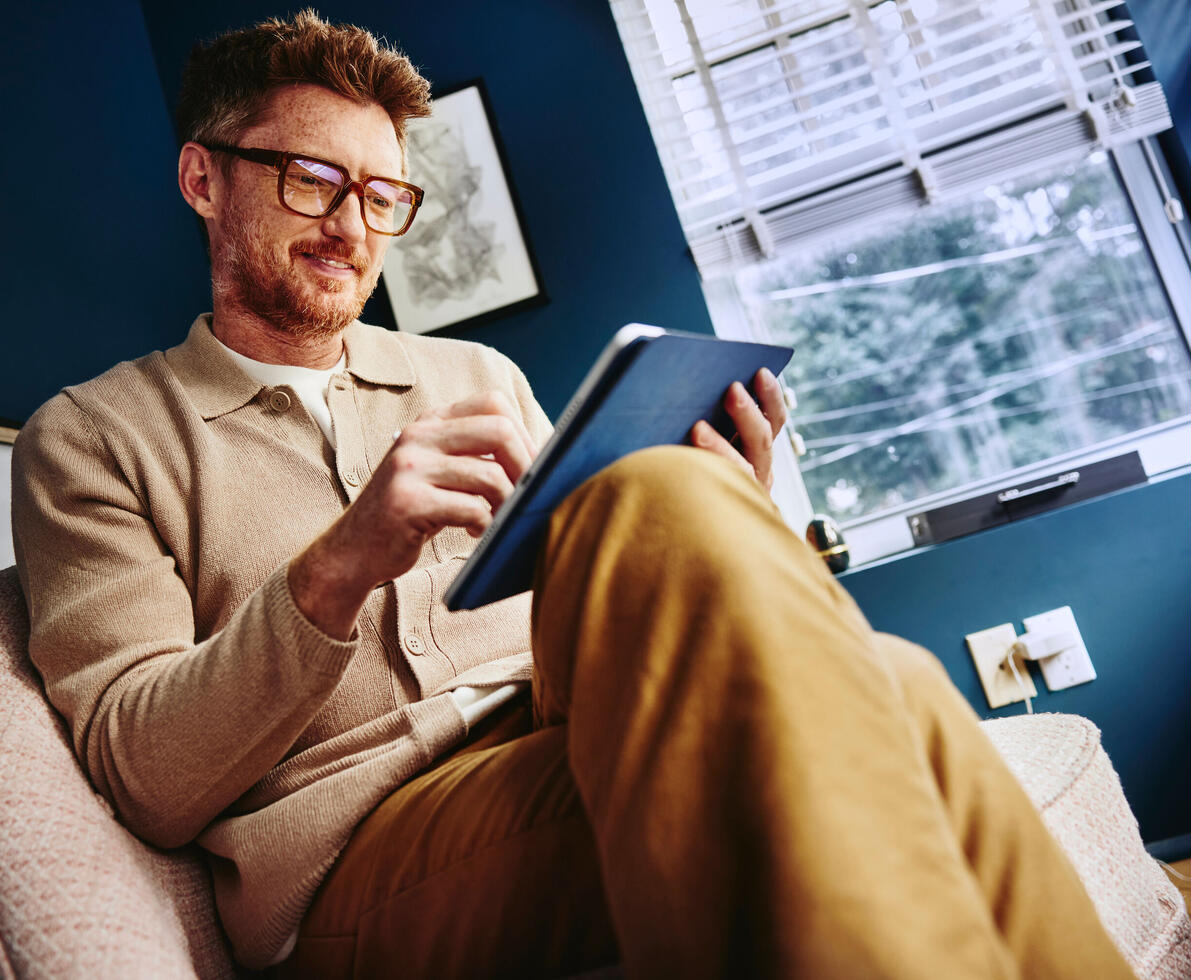 man looking at a tablet 