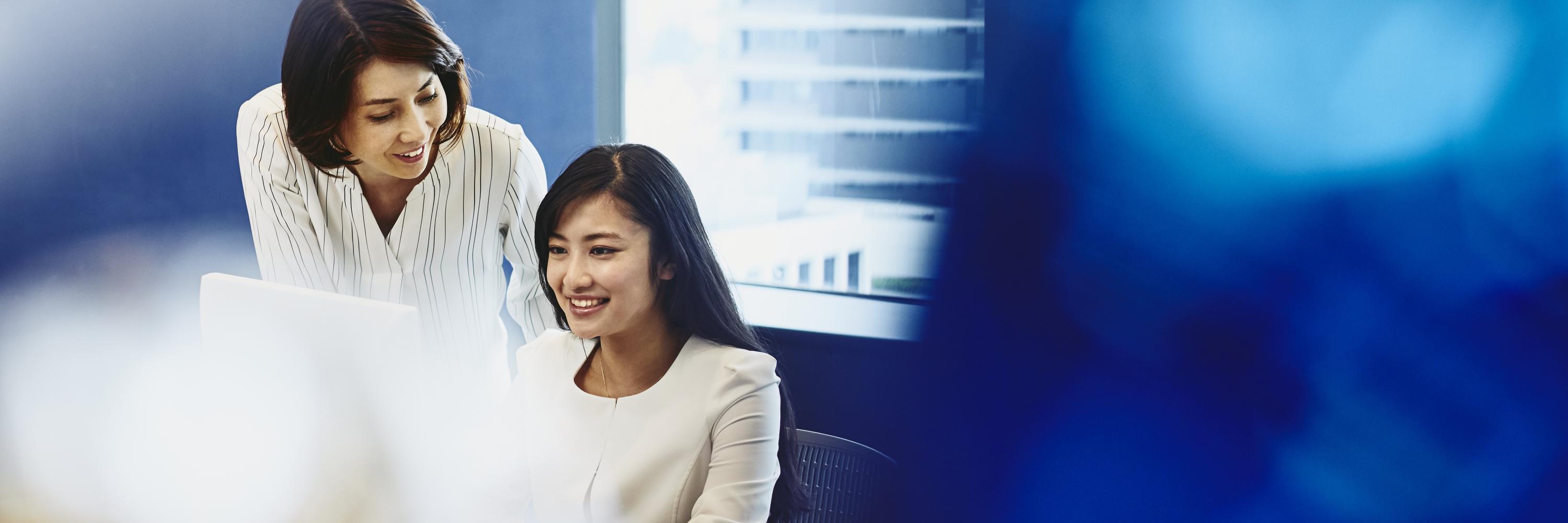 a lady is talking to her colleague